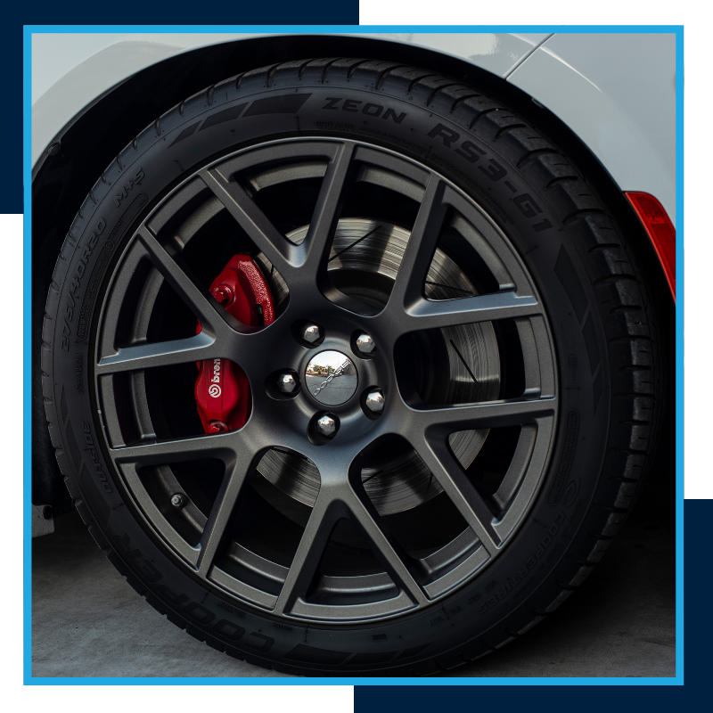 cool black wheels with red calipers